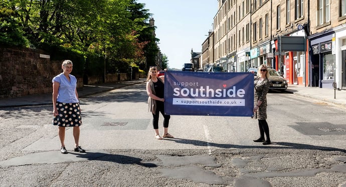 Photo of Support Southside team with banner on Morningside Road during Lockdown 2020